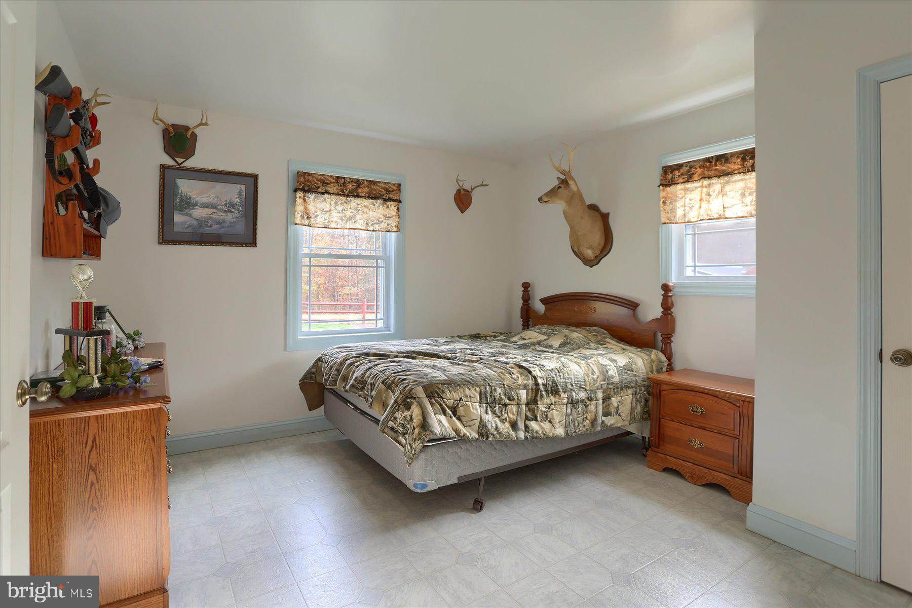7504 Raccoon Valley Road Millerstown, PA 17062 - Photo 28 of 71 a bedroom with a bed and a window