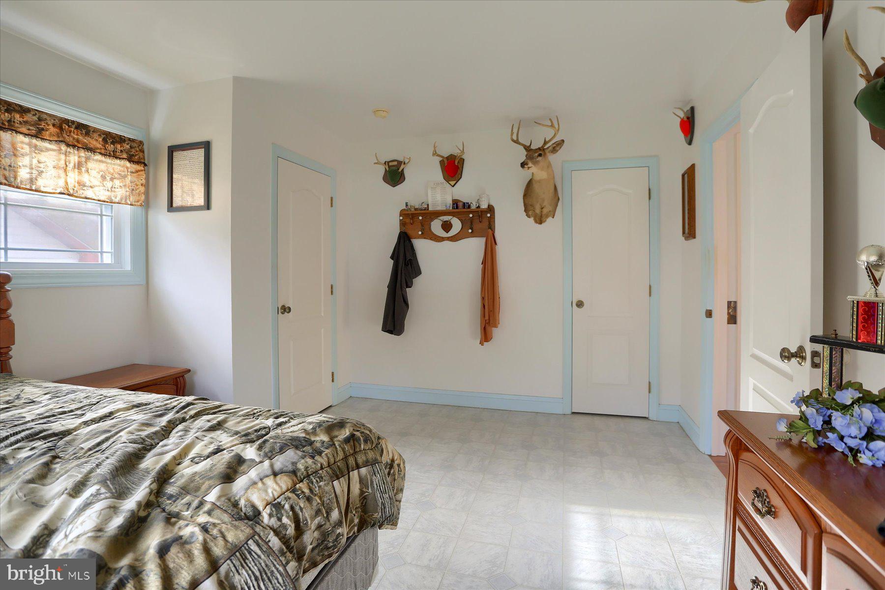 7504 Raccoon Valley Road Millerstown, PA 17062 - Photo 29 of 71 a bedroom with a bed and a window