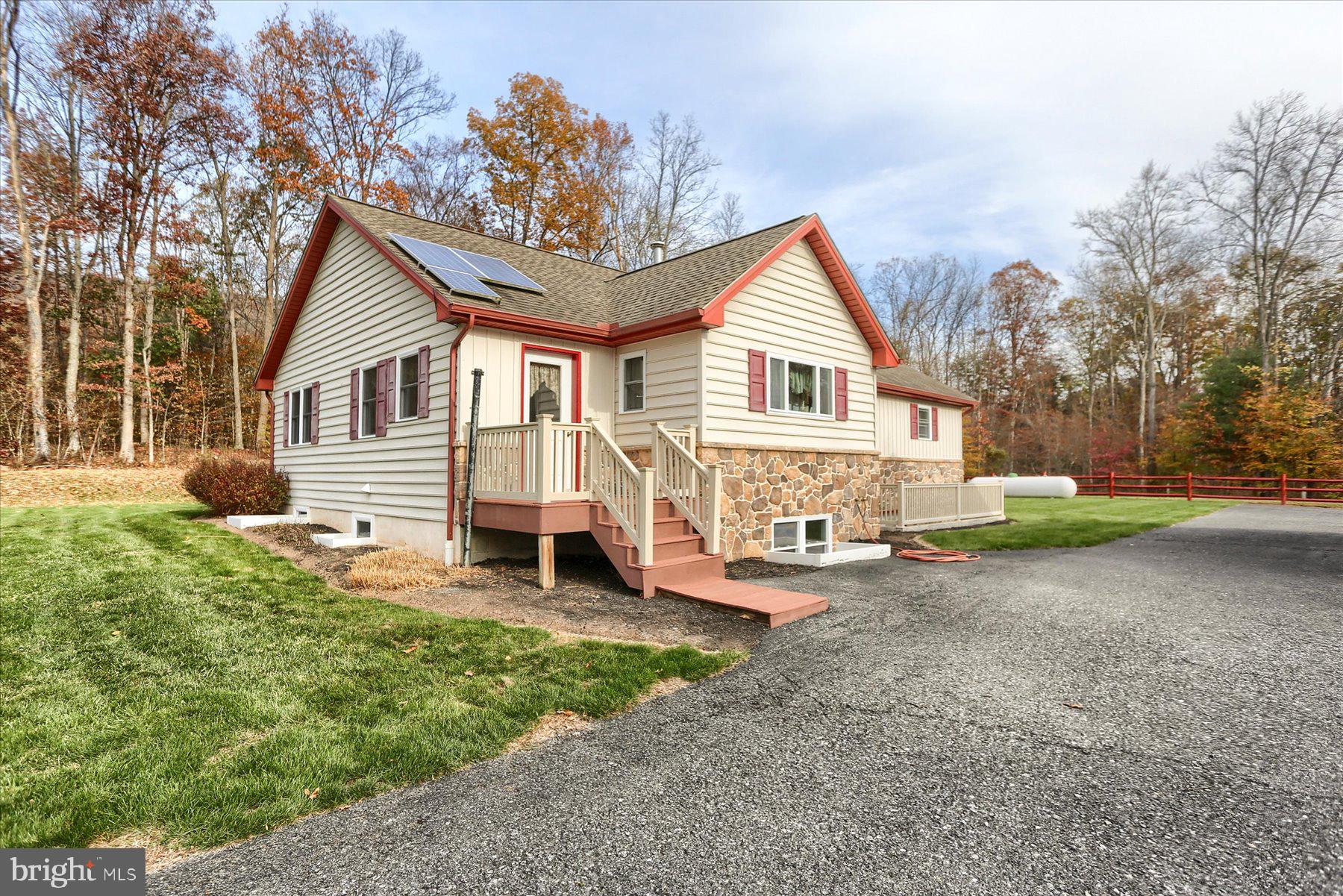 7504 Raccoon Valley Road Millerstown, PA 17062 - Photo 3 of 71 a view of a house with a yard and sitting area