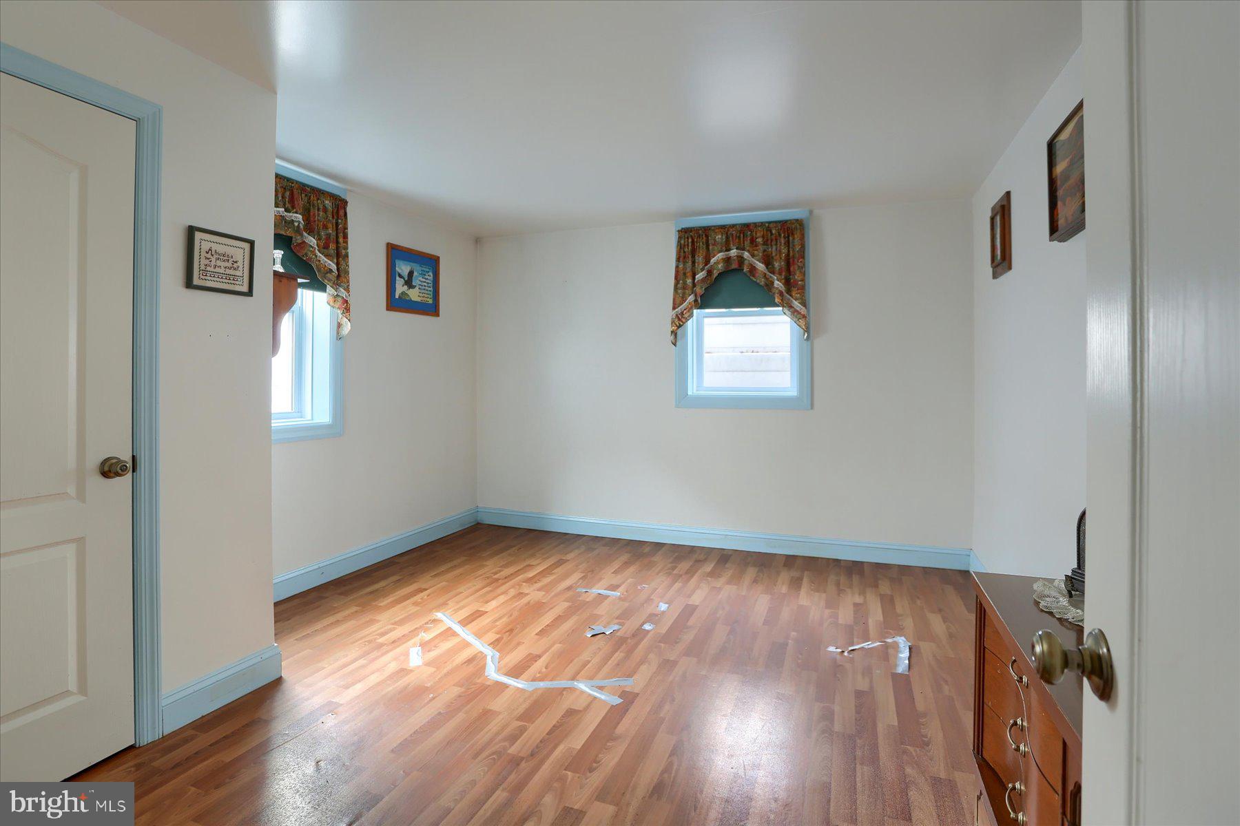 7504 Raccoon Valley Road Millerstown, PA 17062 - Photo 33 of 71 a view of empty room with wooden floor and fan