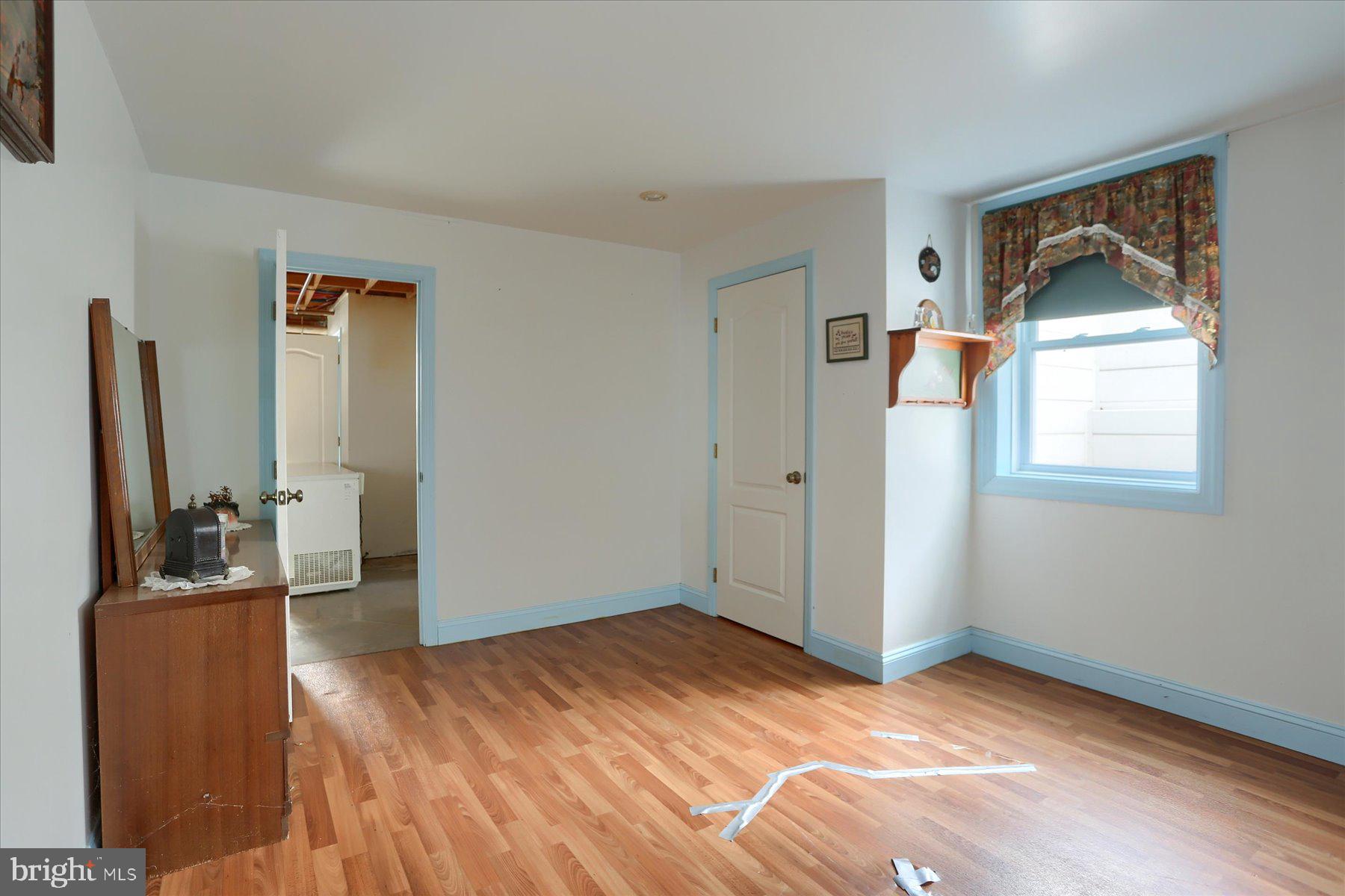 7504 Raccoon Valley Road Millerstown, PA 17062 - Photo 35 of 71 a view of a livingroom with wooden floor and a flat screen tv