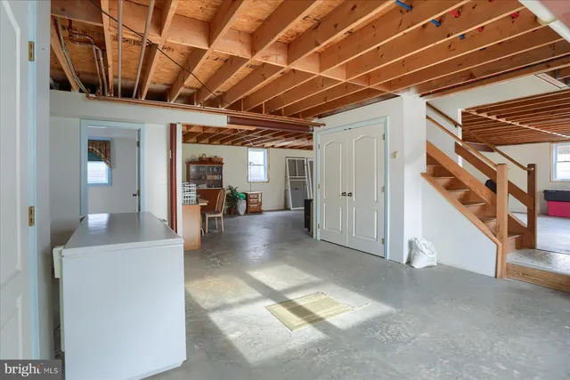 a view of a house with a yard and garage