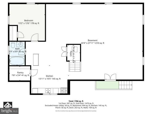 a view of a house with a yard and large trees