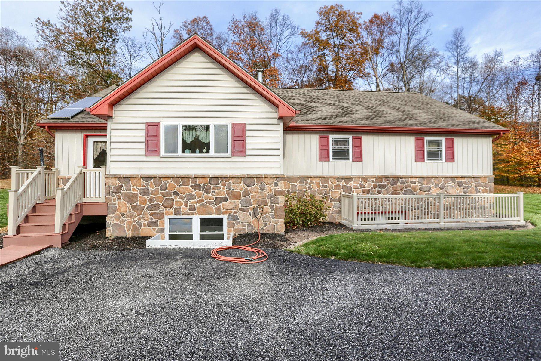 7504 Raccoon Valley Road Millerstown, PA 17062 - Photo 48 of 71 a view of a house with a yard and garage