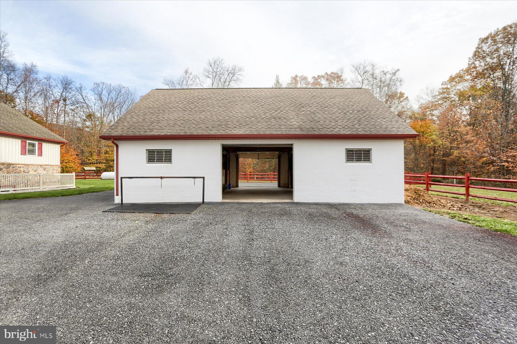 7504 Raccoon Valley Road Millerstown, PA 17062 - Photo 53 of 71 a view of garage yard and front view of a house