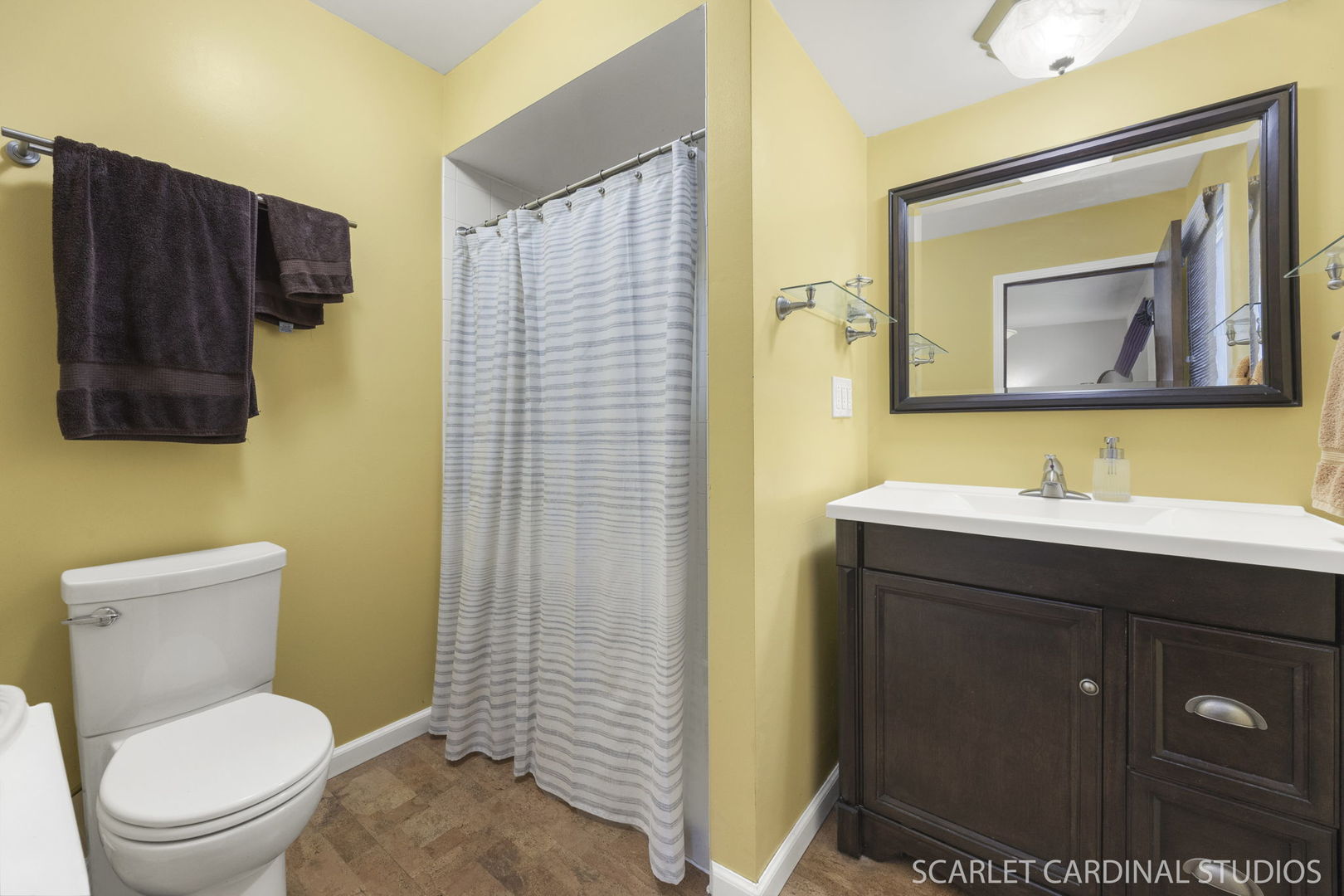 4705 Elm Street Lisle, IL 60532 - Photo 17 of 21 a bathroom with a toilet sink vanity and mirror