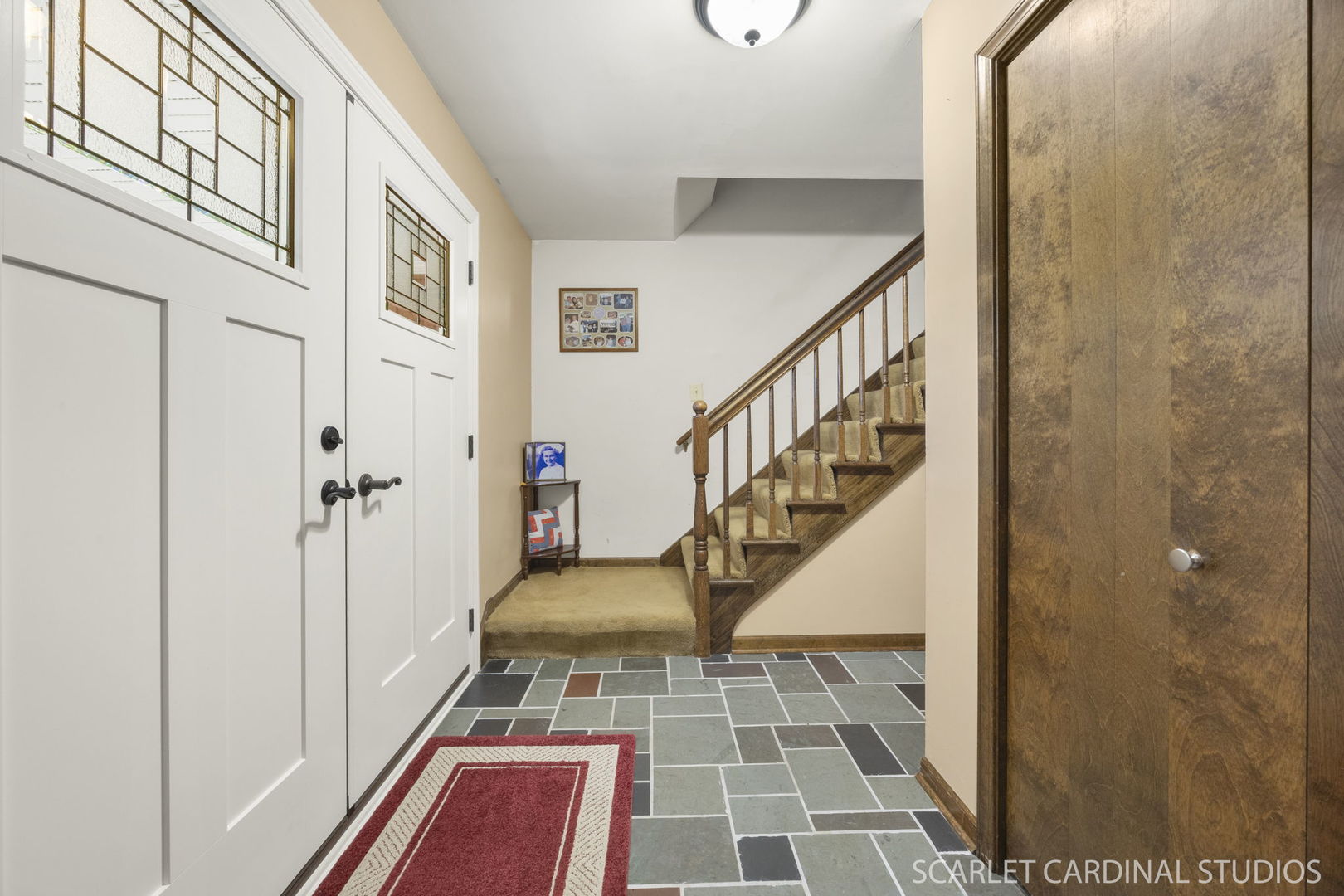 4705 Elm Street Lisle, IL 60532 - Photo 2 of 21 a view of a hallway with wooden floor and staircase