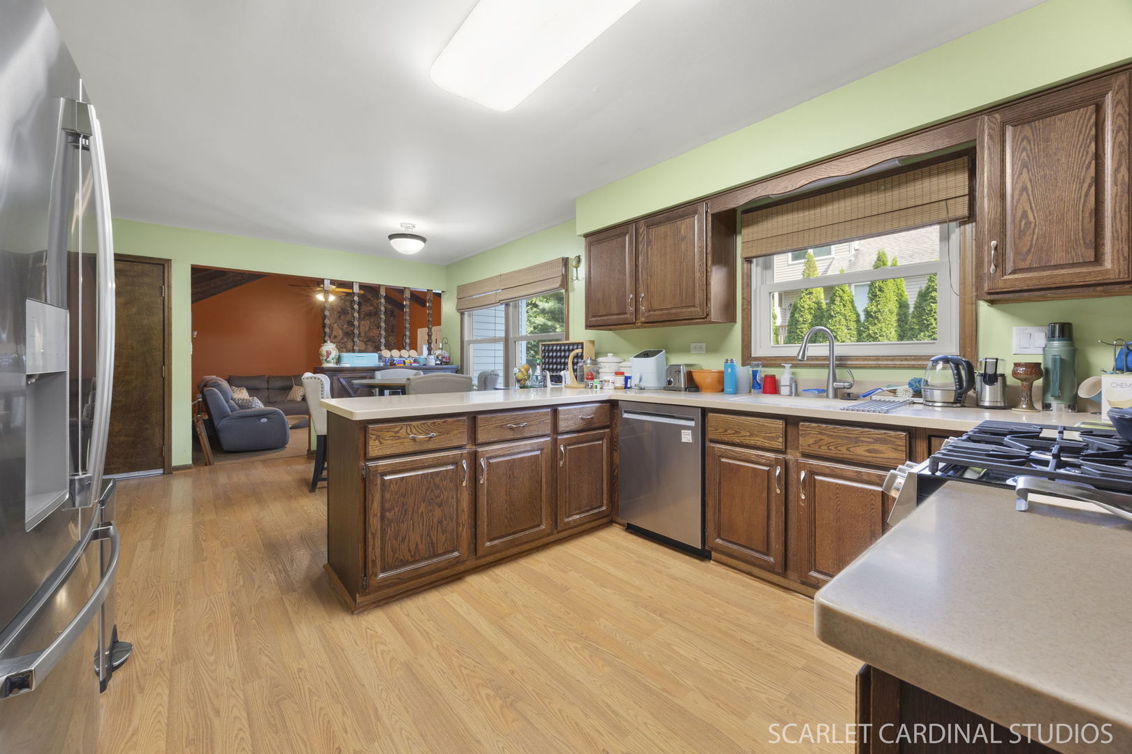 4705 Elm Street Lisle, IL 60532 - Photo 4 of 21 a kitchen with a sink wooden floors and appliances