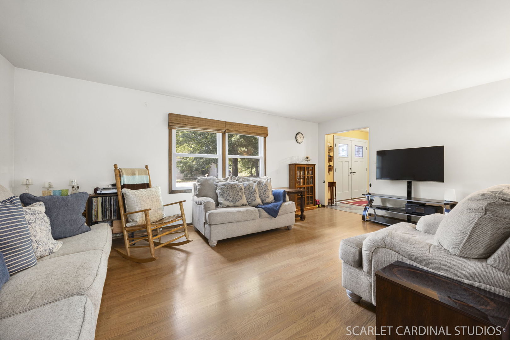 4705 Elm Street Lisle, IL 60532 - Photo 8 of 21 a living room with furniture and a flat screen tv