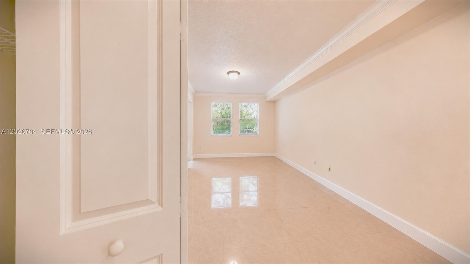 4106 Renaissance Way, Unit 106 Boynton Beach, FL 33426 - Photo 9 of 14 a view of an empty room and window
