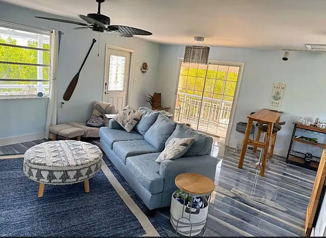 a living room with furniture and a table