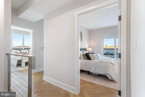 a bedroom with a bed and a view of bedroom