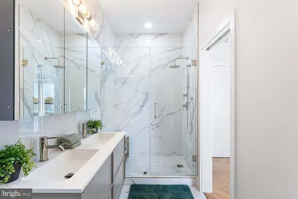 a bathroom with a sink and a shower