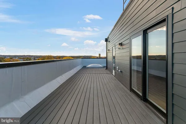 a view of balcony with wooden floor