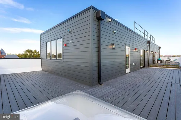 a backyard of a house with wooden floor
