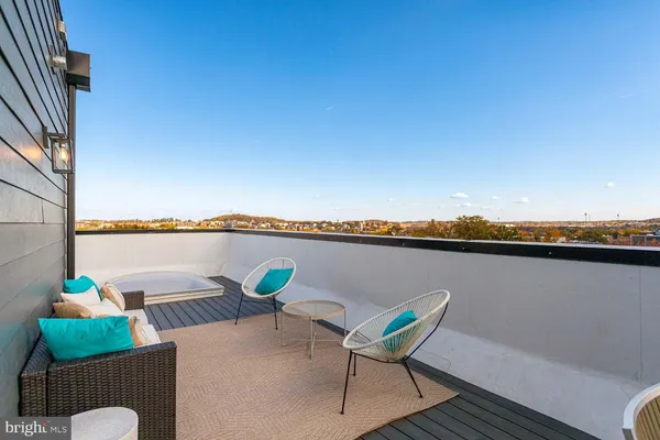 a view of a chairs and table in patio