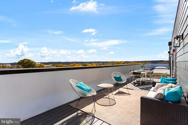 a view of a chairs and table on the terrace