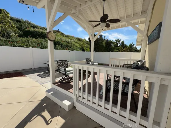 a roof deck with table and chairs a barbeque