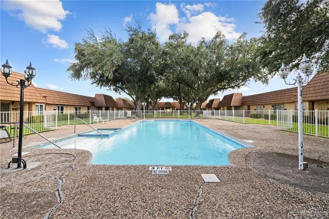 a view of a swimming pool with a patio