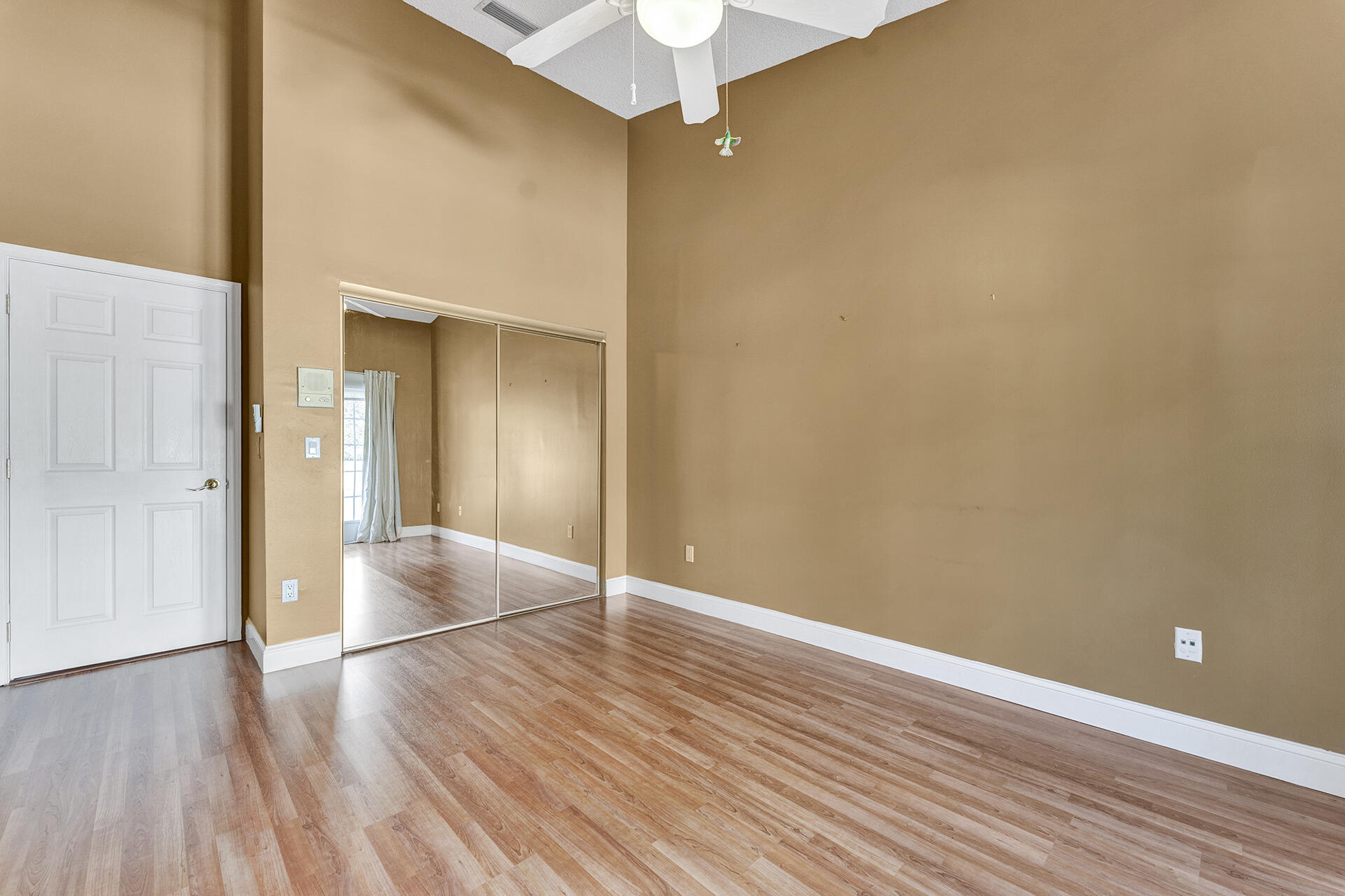 23024 Via Stel Boca Raton, FL 33433 - Photo 6 of 43 a view of an empty room with wooden floor
