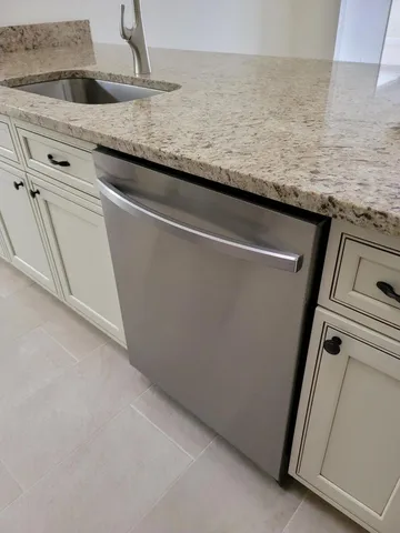 a view of a refrigerator and microwave