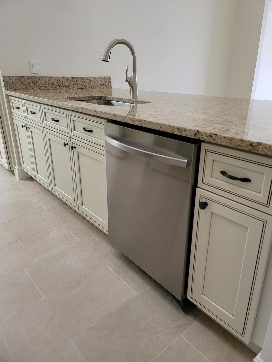 11000 Ladera Lane, Unit B Boca Raton, FL 33498 - Photo 15 of 29 a close view of a sink a mirror and cabinets