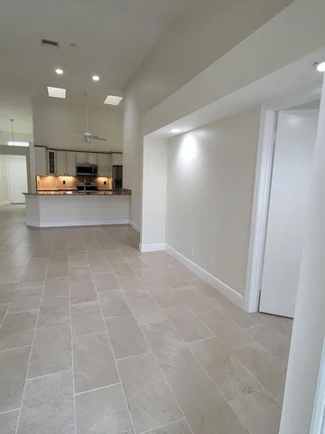 a kitchen with a sink and a granite counter top
