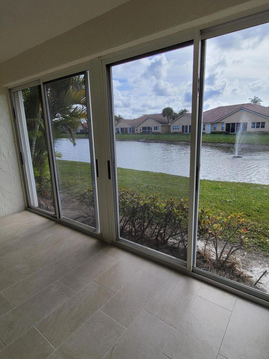 11000 Ladera Lane, Unit B Boca Raton, FL 33498 - Photo 18 of 29 a view of a garden from a window