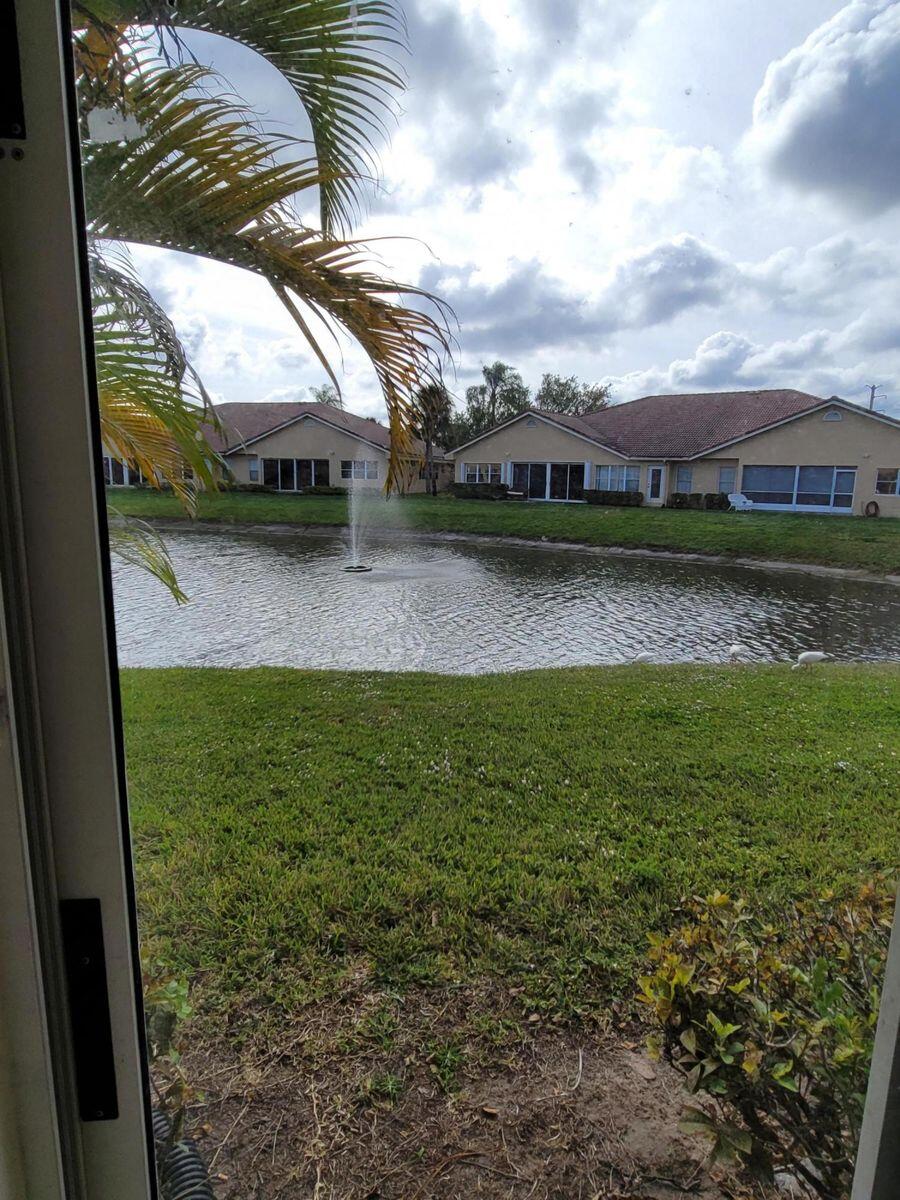 11000 Ladera Lane, Unit B Boca Raton, FL 33498 - Photo 19 of 29 a view of a house with a yard