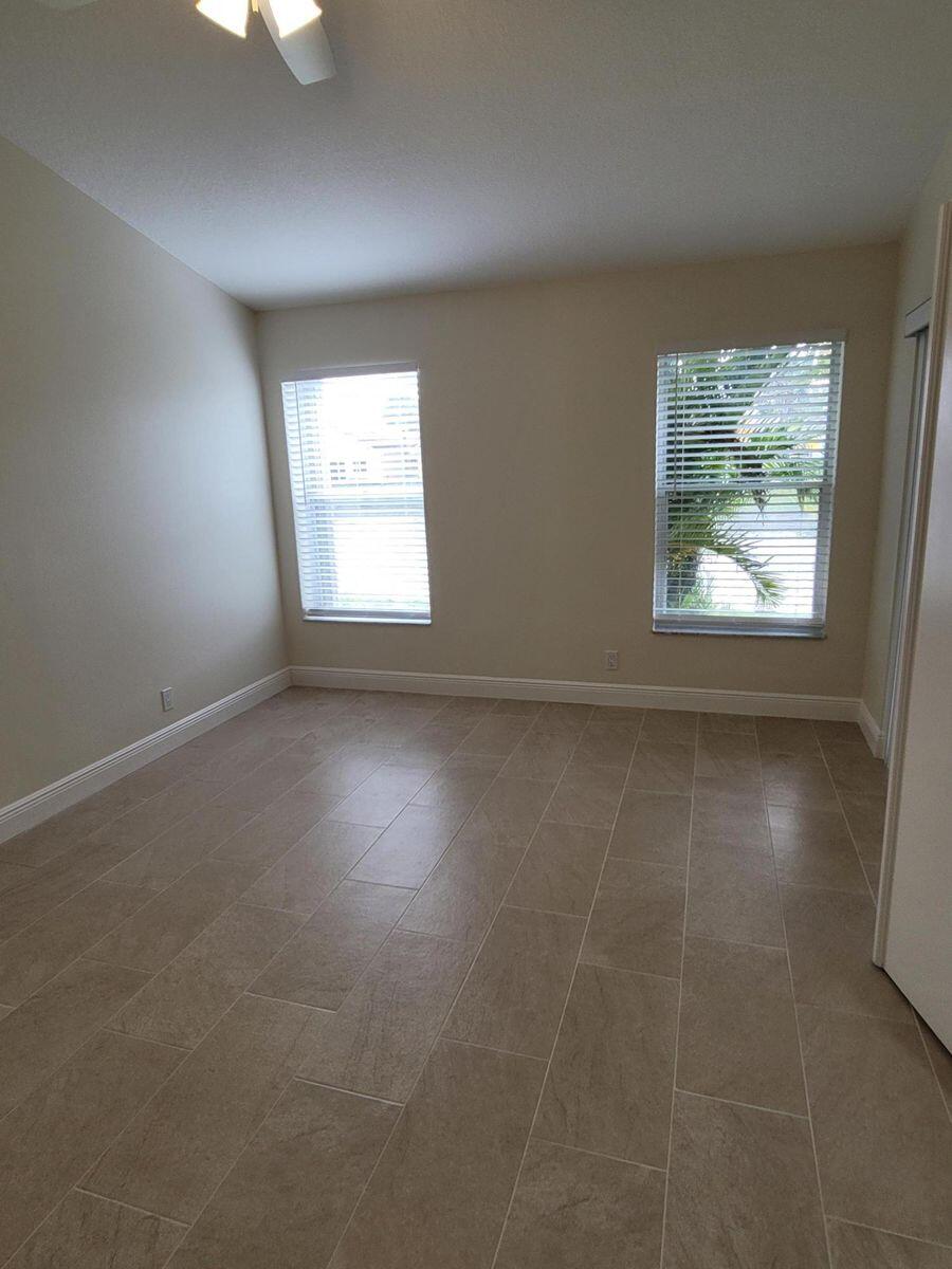 11000 Ladera Lane, Unit B Boca Raton, FL 33498 - Photo 20 of 29 an empty room with a window