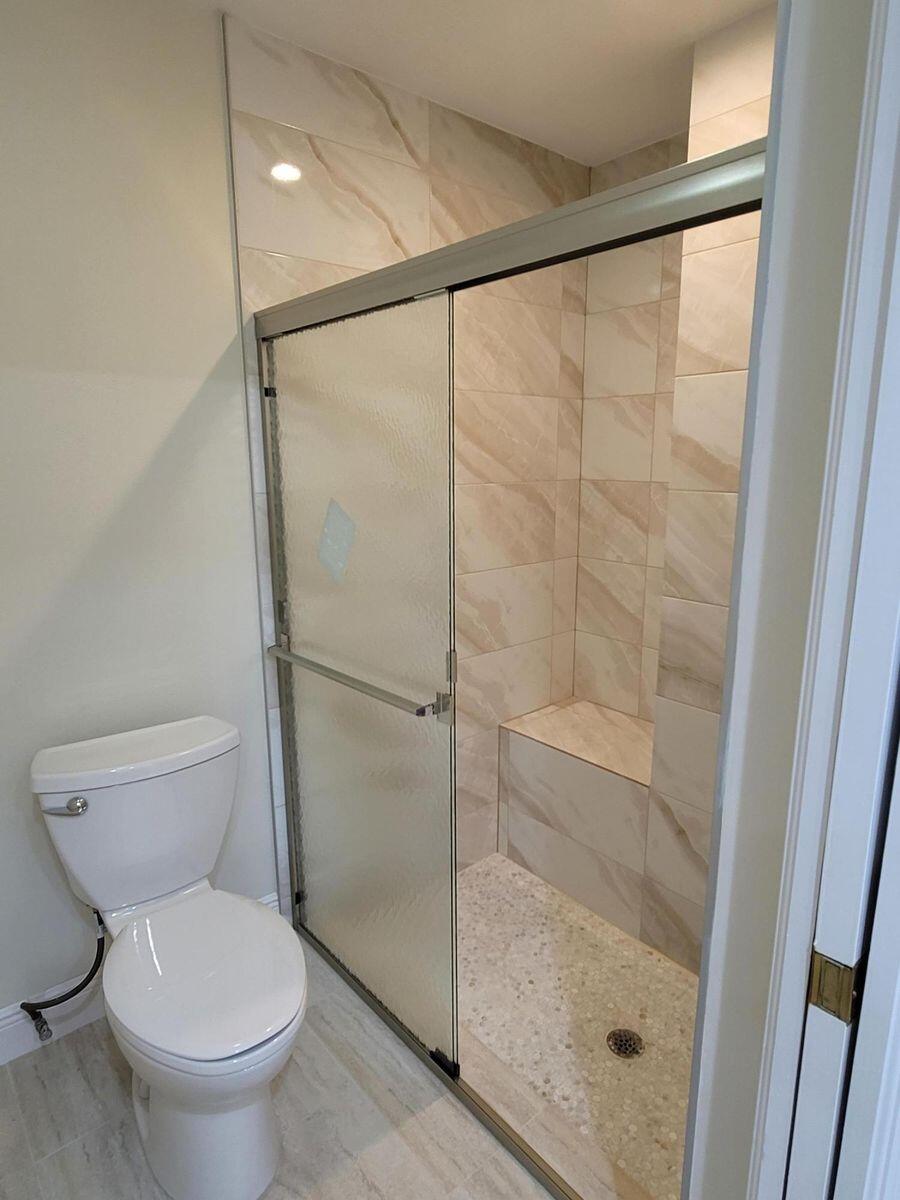 11000 Ladera Lane, Unit B Boca Raton, FL 33498 - Photo 22 of 29 a bathroom with a shower and a toilet