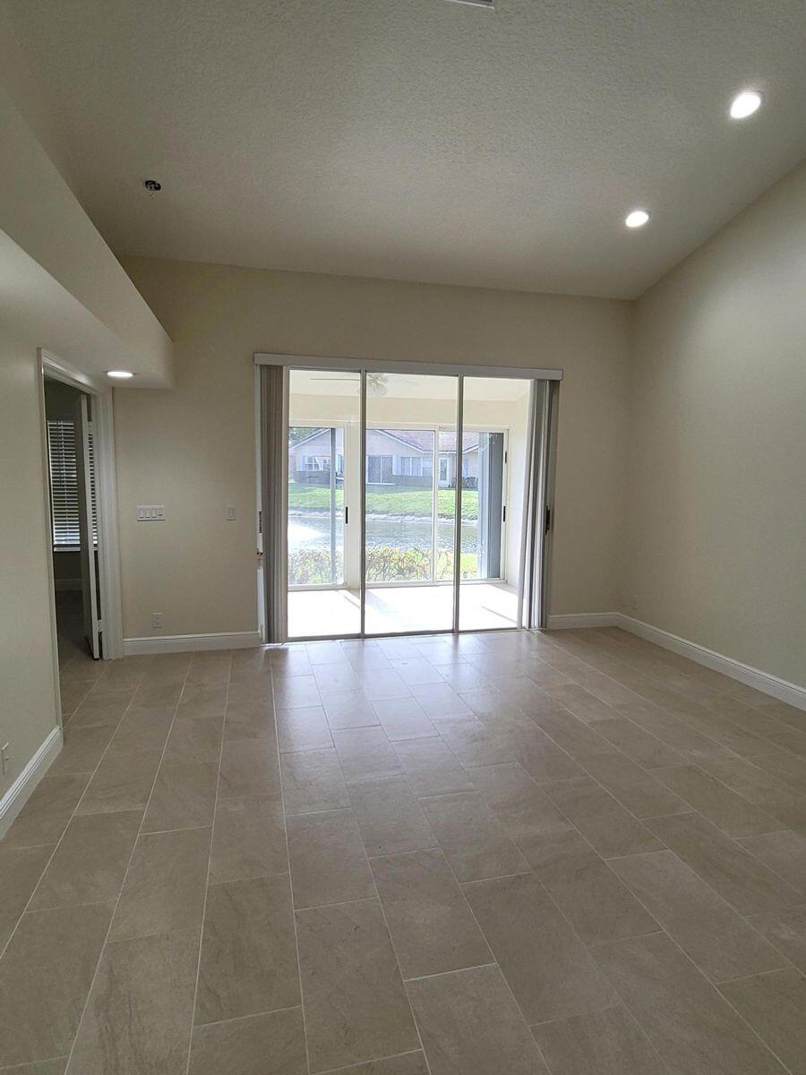11000 Ladera Lane, Unit B Boca Raton, FL 33498 - Photo 24 of 29 an empty room with windows and view of an empty room