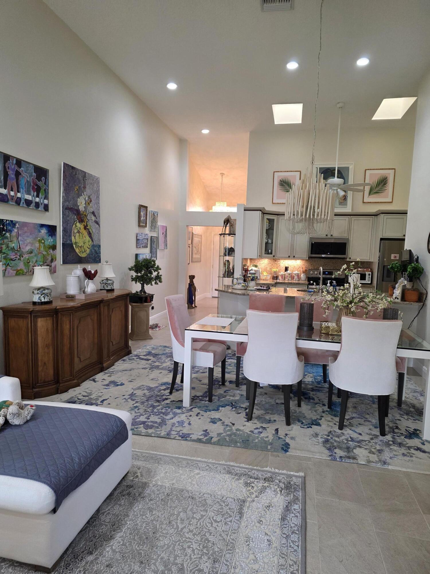 11000 Ladera Lane, Unit B Boca Raton, FL 33498 - Photo 29 of 29 a living room with furniture a rug and a painting