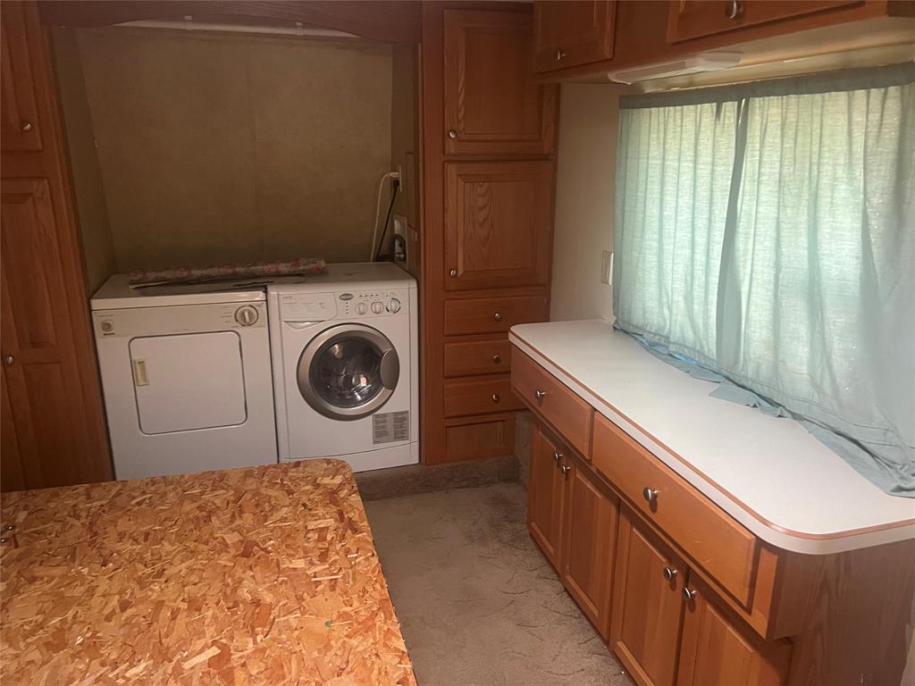 433 HCR 2105 Loop North Whitney, TX 76692 - Photo 4 of 5 a utility room with dryer and washer