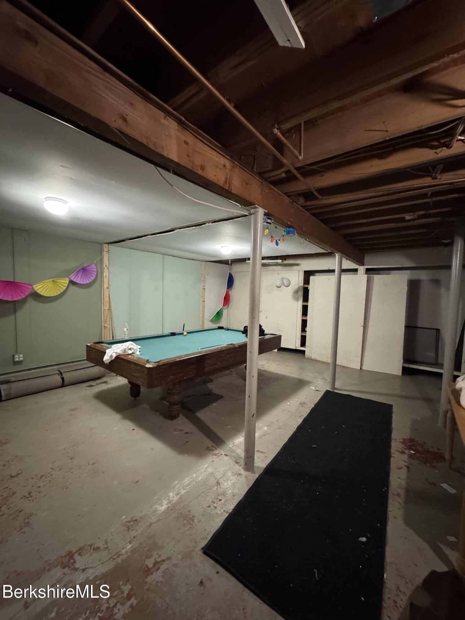 271 Brodie Mountain Road Hancock, MA 01237 - Photo 26 of 27 a living room with furniture and a flat screen tv