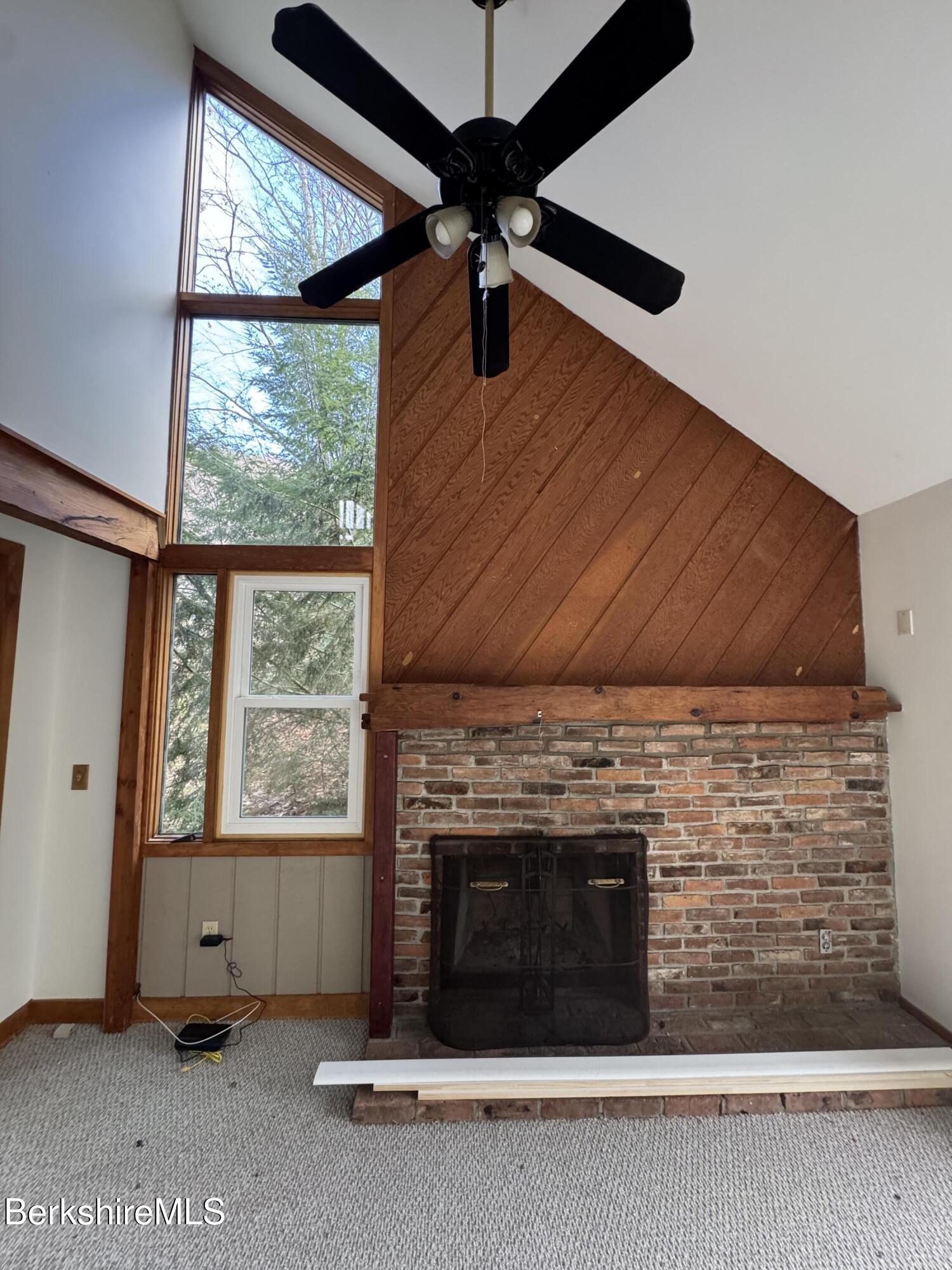 271 Brodie Mountain Road Hancock, MA 01237 - Photo 8 of 27 wooden floor in an empty room with a window