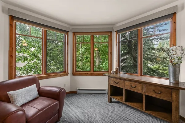 a living room with furniture and windows