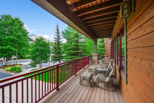 a view of balcony with couch and wooden floor