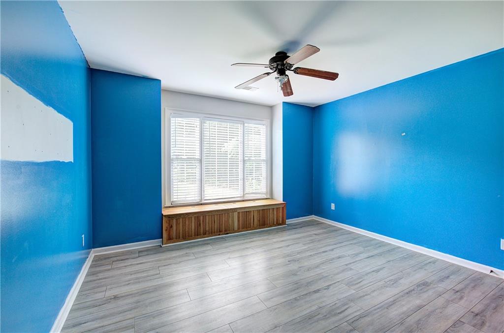 561 Holland Road Dallas, GA 30157 - Photo 20 of 48 a view of an empty room with window and wooden floor