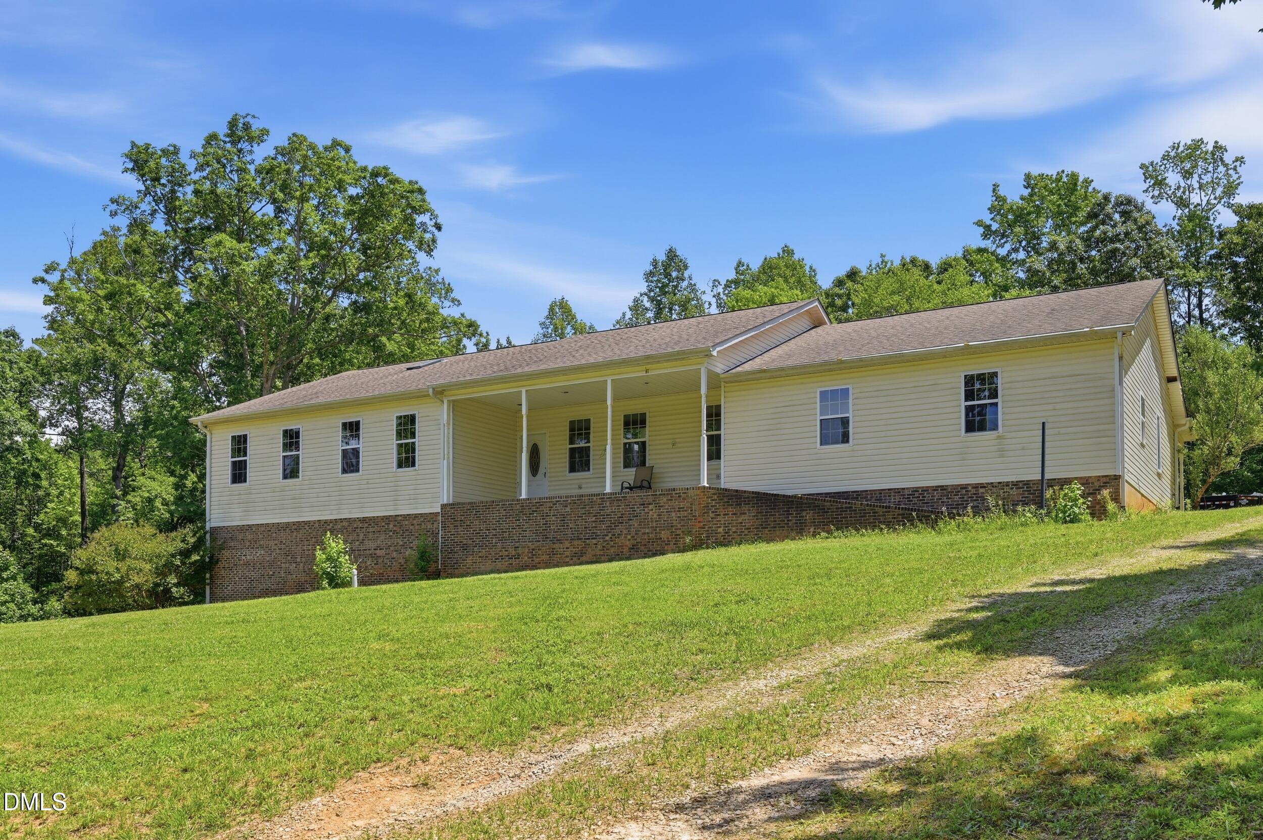 129 Shaman Drive Spring Hope, NC 27882 - Photo 5 of 43 a front view of a house with a yard