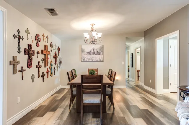 a living room with furniture ceiling fan and a window