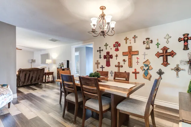 a living room with furniture dining area and a fireplace