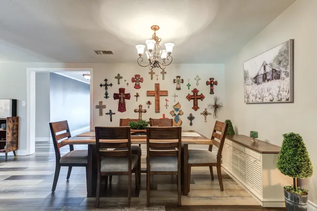 a view of a dining room with furniture and a fireplace