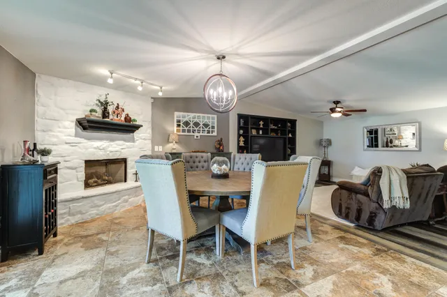 a bathroom with a double vanity sink mirror and toilet