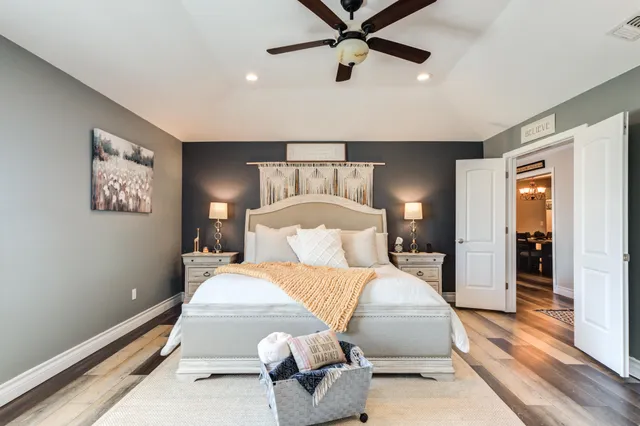 a view of backyard with outdoor seating and plants