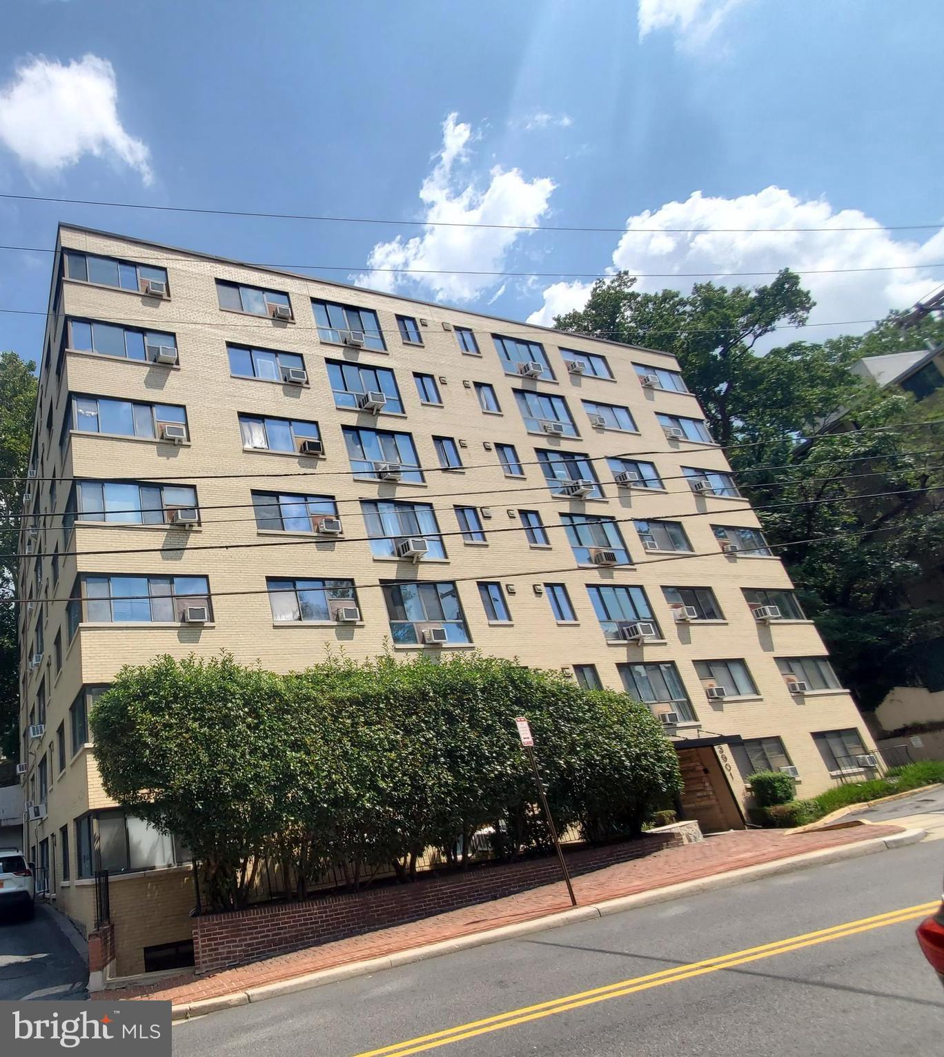 3901 Tunlaw Road Northwest, Unit 502 Washington, DC 20007 - Photo 2 of 34 a view of a building and a yard