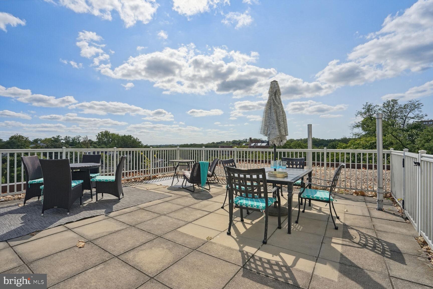 3901 Tunlaw Road Northwest, Unit 502 Washington, DC 20007 - Photo 21 of 34 a view of a terrace with furniture