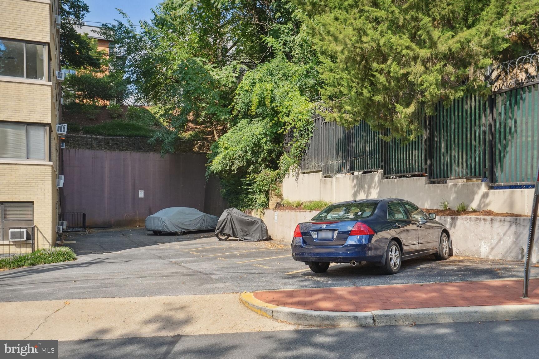 3901 Tunlaw Road Northwest, Unit 502 Washington, DC 20007 - Photo 28 of 34 a car parked in front of a house