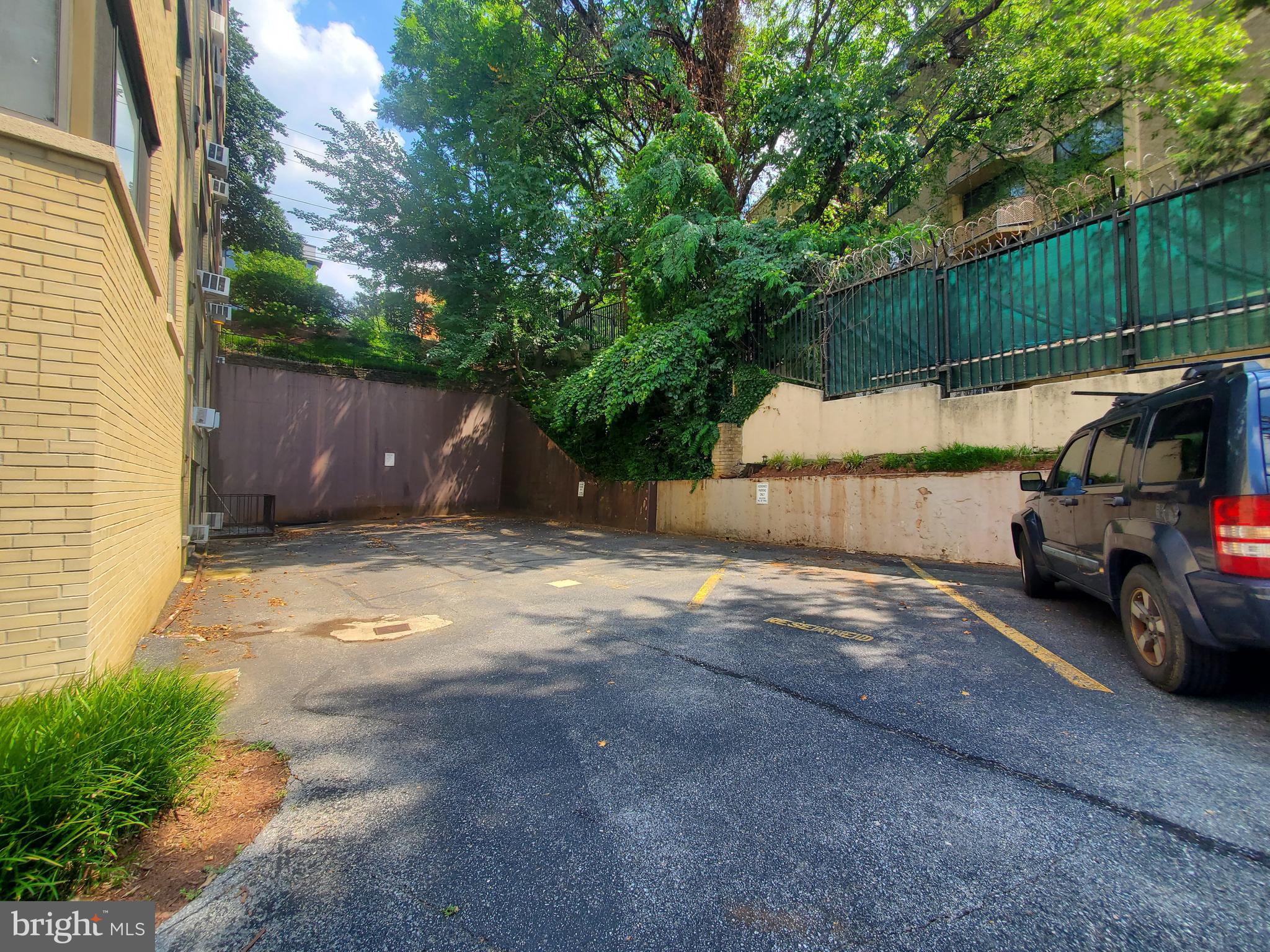 3901 Tunlaw Road Northwest, Unit 502 Washington, DC 20007 - Photo 29 of 34 a view of a car parked in back of a house