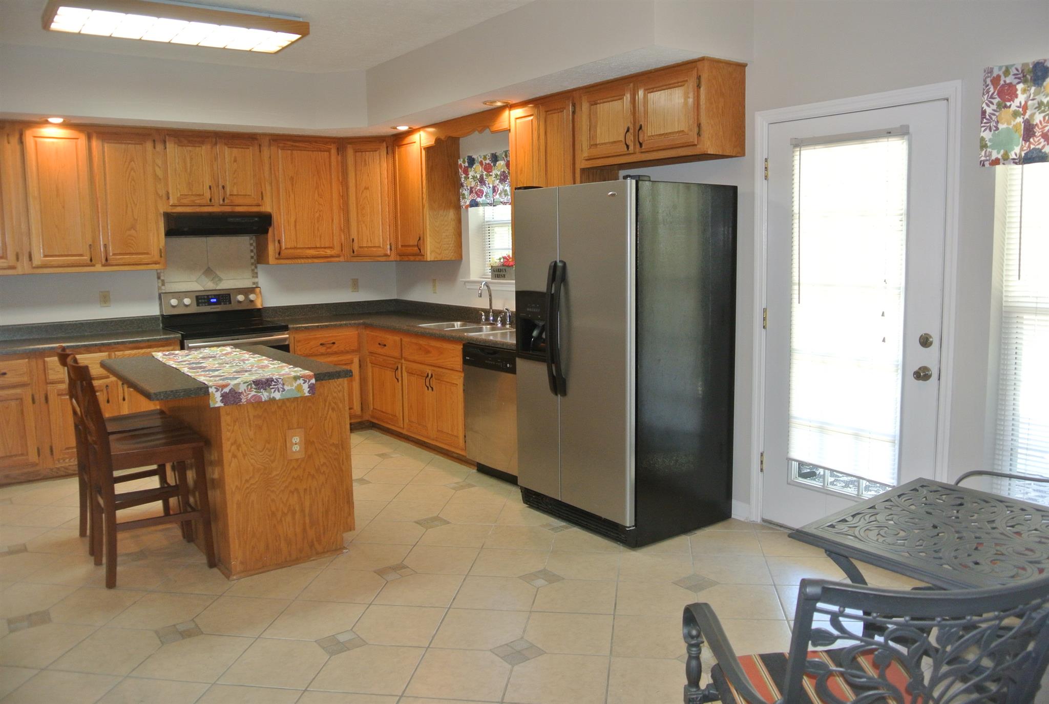 923 Emilee Point Gallatin, TN 37066 - Photo 12 of 30 Custom Oak Cabinetry-Ample Lighting- Ceramic Tile Floors